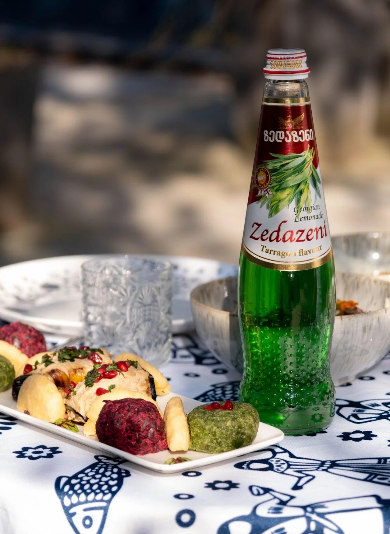 A bottle of tarragon lemonade among Georgian dishes